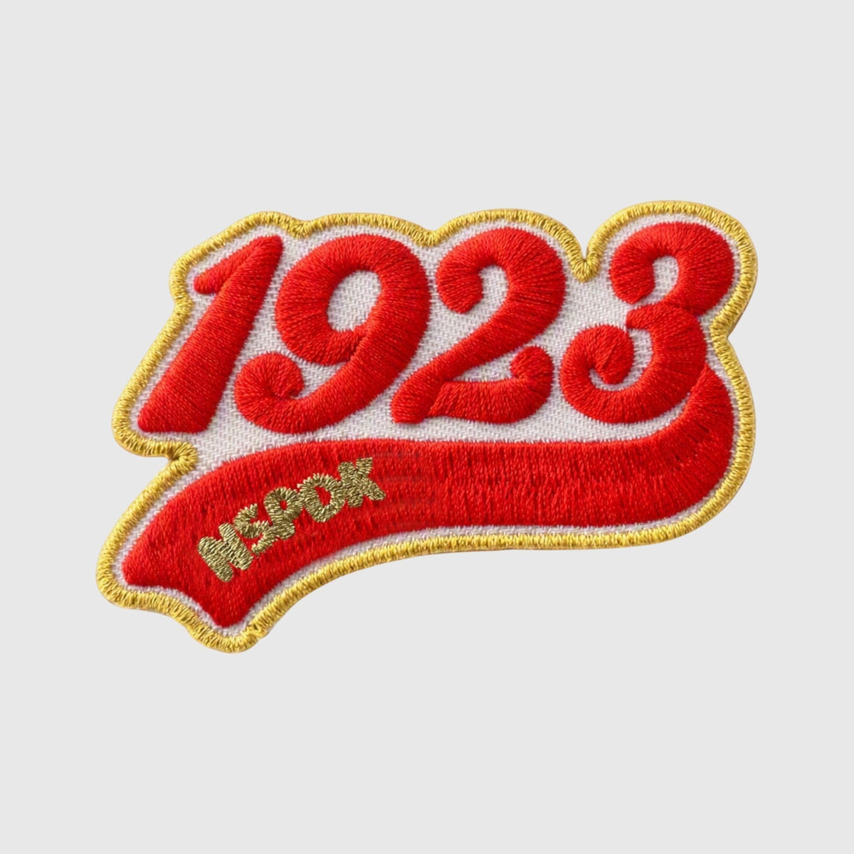 Pat Goffe Collections 1923 embroidered patch with red lettering, white background, and gold trim border.