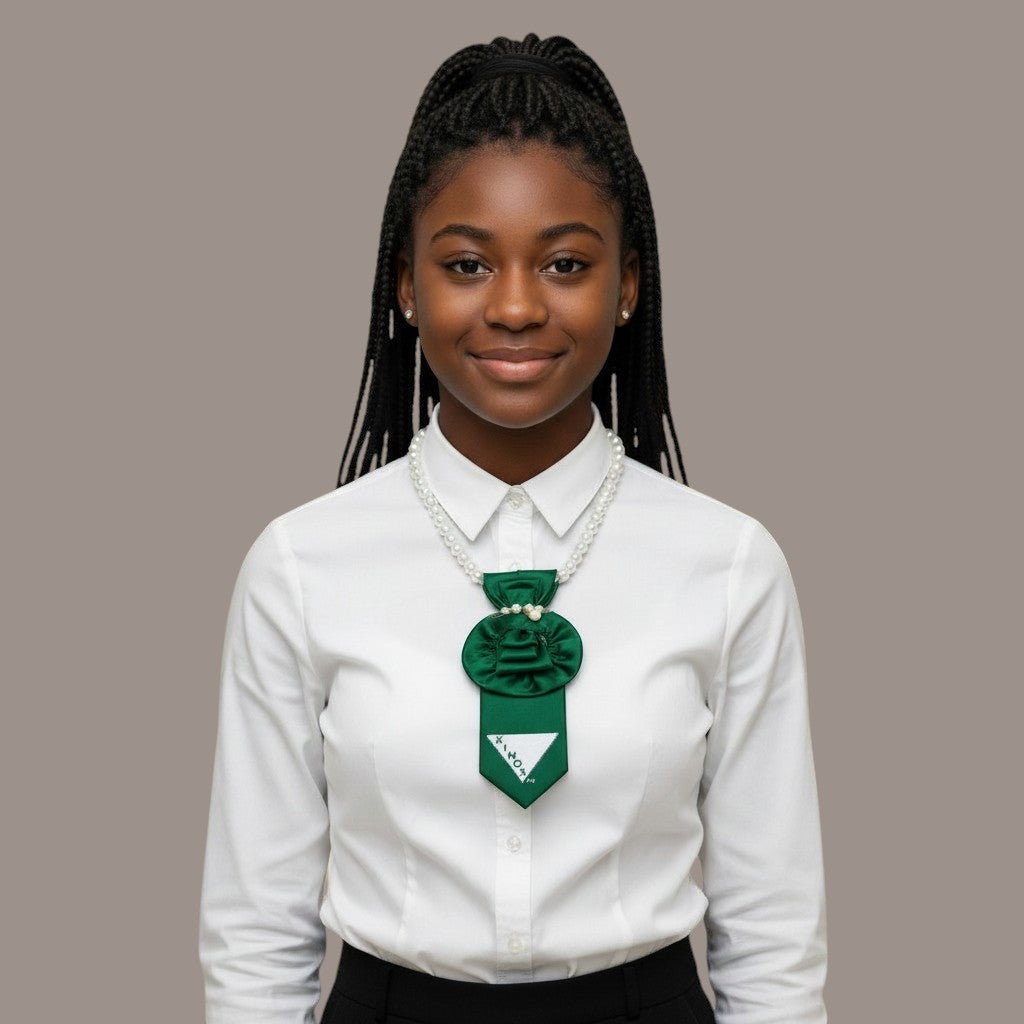 Pat Goffe Collections pearl and green satin rosette neck accessory worn by a young woman in a white blouse