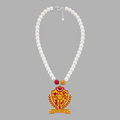 Pat Goffe Collections pearl necklace featuring a red and gold NSPDK shield pendant with crystal accents