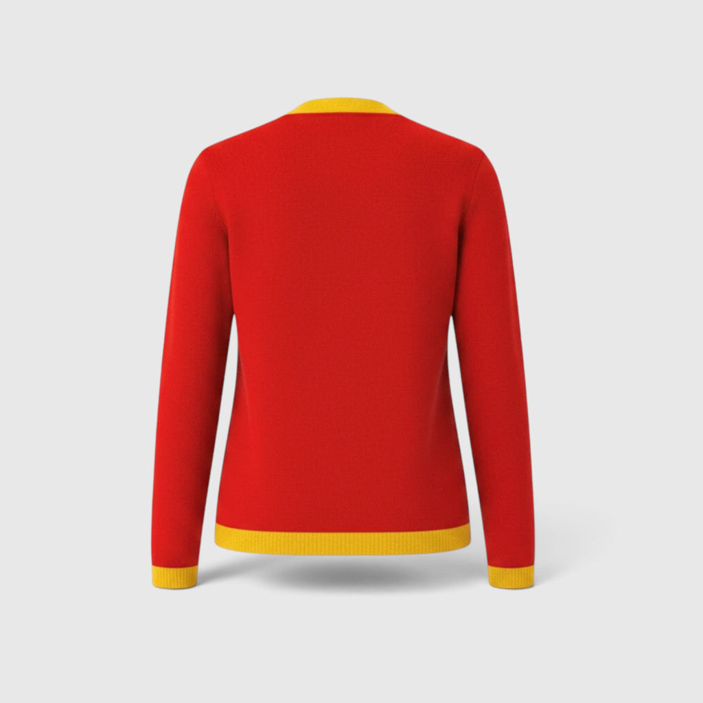 Pat Goffe Collections red knit cardigan with gold trim on the cuffs and hem, back view.