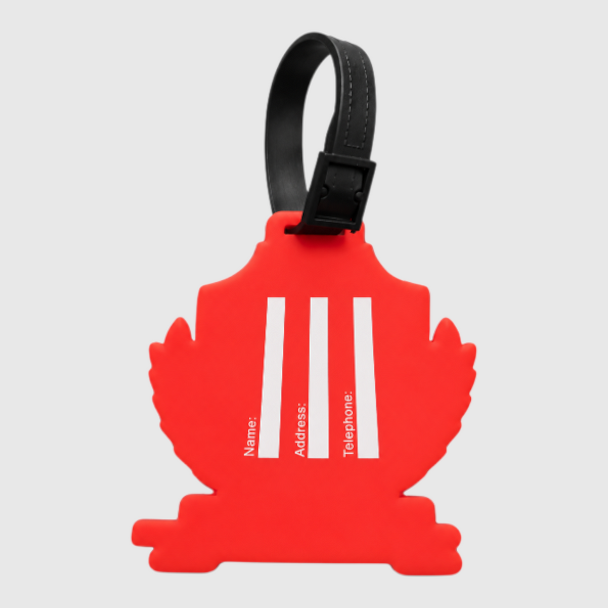 Pat Goffe Collections red silicone luggage tag with white contact information lines and a black adjustable strap.
